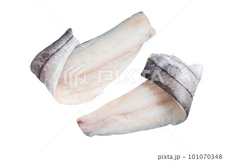 Two raw haddock fish fillets on kitchen table. Isolated on white background Two raw haddock fish fillets on kitchen table. Isolated on white background 101070348