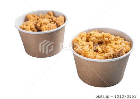 Crunchy chicken popcorn bites in a basket from fastfood. Isolated on white background 101070365