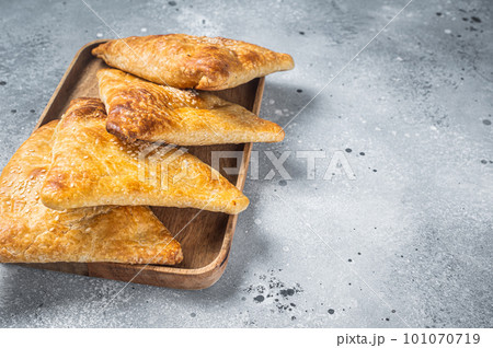 Samosa, samsa meat stuffed oriental pies. Gray background. Top view. Copy space 101070719