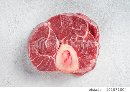 Raw Osso buco Veal shank steak, meat Ossobuco. White background. Top view. Copy space 101071004