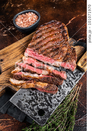 Barbecue dry aged wagyu entrecote rib eye beef steak. Dark background. Top view Barbecue dry aged wagyu entrecote rib eye beef steak. Dark background. Top view 101071970