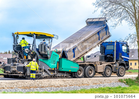 machine asphalting of roads. truck with asphalt. the creation of a new transport communication and infrastructure 101075664