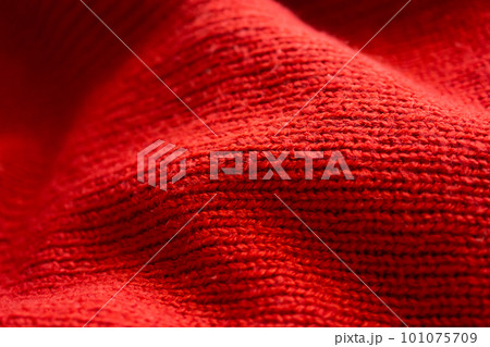 closeup red knitted woolen fabric texture background closeup red knitted woolen fabric texture background 101075709