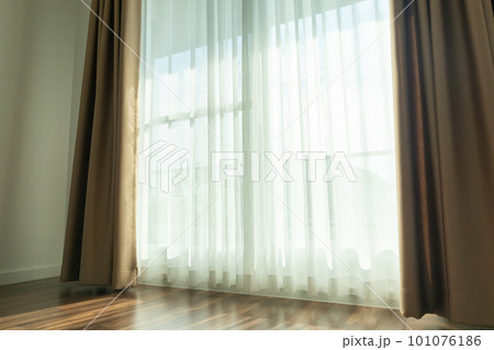 Curtain window interior decoration in living room on sunny day with sunlight 101076186
