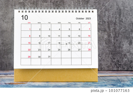 The October 2023 Monthly desk calendar for 2023 year on wooden table. The October 2023 Monthly desk calendar for 2023 year on wooden table. 101077163