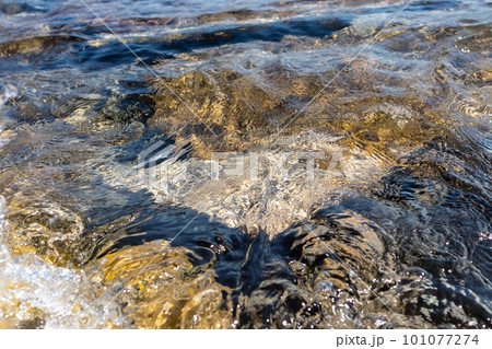 Aegean sea rocks close-up in clear sparkling water Aegean sea rocks close-up in clear sparkling water 101077274