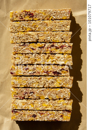Homemade Granola energy bar. Variety of homemade protein granola breakfast bars, with nuts, raisins dried cherries and chocolate. Healthy nutrition eating Gluten free cereal dieting snack super food Homemade Granola energy bar. Variety of homemade protein granola breakfast bars, with nuts, raisins dried cherries and chocolate. Healthy nutrition eating Gluten free cereal dieting snack super food 101079717