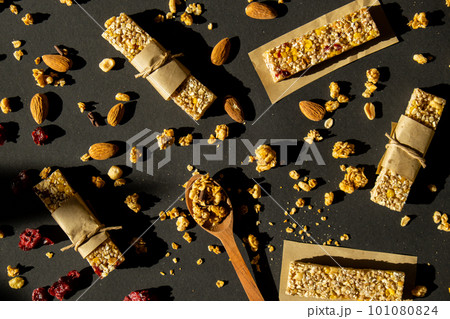 Homemade Granola energy bar. Variety of homemade protein granola breakfast bars ingredients nuts, raisins dried cherries and chocolate. Healthy nutrition eating Gluten free cereal dieting snack super Homemade Granola energy bar. Variety of homemade protein granola breakfast bars ingredients nuts, raisins dried cherries and chocolate. Healthy nutrition eating Gluten free cereal dieting snack super 101080824