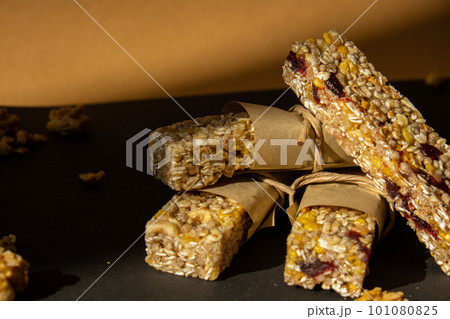 Homemade Granola energy bar. Variety of homemade protein granola breakfast bars with nuts, raisins dried cherries and chocolate. Healthy nutrition eating Gluten free cereal dieting snack super food Homemade Granola energy bar. Variety of homemade protein granola breakfast bars with nuts, raisins dried cherries and chocolate. Healthy nutrition eating Gluten free cereal dieting snack super food 101080825