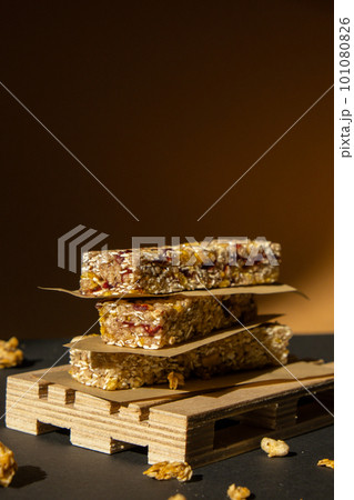 Homemade Granola energy bar. Variety of homemade protein granola breakfast bars with nuts, raisins dried cherries and chocolate. Healthy nutrition eating Gluten free cereal dieting snack super food Homemade Granola energy bar. Variety of homemade protein granola breakfast bars with nuts, raisins dried cherries and chocolate. Healthy nutrition eating Gluten free cereal dieting snack super food 101080826