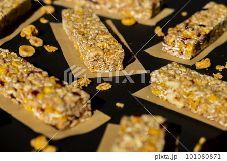 Homemade Granola energy bar. Variety of homemade protein granola breakfast bars, with nuts, raisins dried cherries and chocolate. Healthy nutrition eating Gluten free cereal dieting snack super food 101080871