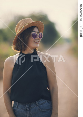 beautiful asian woman wearing straw hat standing outdoor with toothy smiling face beautiful asian woman wearing straw hat standing outdoor with toothy smiling face 101080940