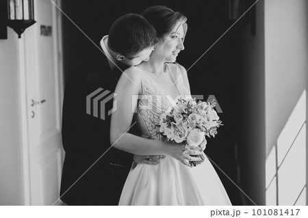 Romantic wedding moment, couple of newlyweds smiling portrait, bride and groom hugging Romantic wedding moment, couple of newlyweds smiling portrait, bride and groom hugging 101081417