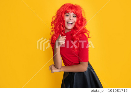 amazed teen kid with red long hair on yellow background amazed teen kid with red long hair on yellow background 101081715