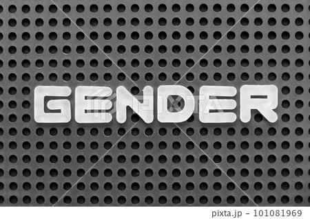 White alphabet letter in word gender on black pegboard background 101081969