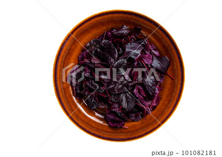 Raw Ruby or red chard salad Leafs on a rustic plate. Isolated on white background. Raw Ruby or red chard salad Leafs on a rustic plate. Isolated on white background. 101082181