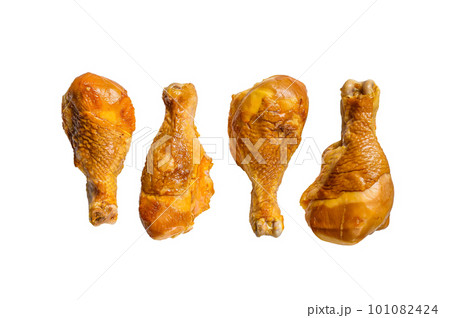 Smoked chicken leg drumsticks on a kitchen table. Isolated on white background. 101082424