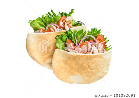 Doner kebab with grilled chicken meat and vegetables in pita bread. Isolated on white background. Doner kebab with grilled chicken meat and vegetables in pita bread. Isolated on white background. 101082691