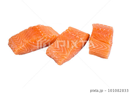 Raw salmon fillet steak on kitchen table. Isolated on white background. Raw salmon fillet steak on kitchen table. Isolated on white background. 101082833