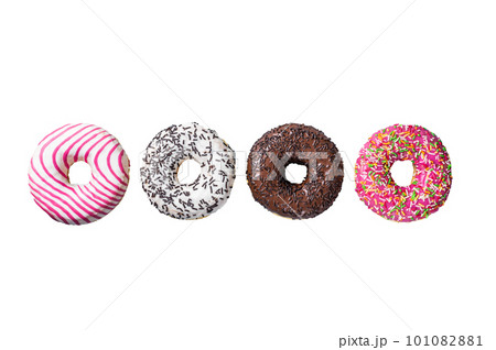 Assorted glazed donuts on a kitchen table. Isolated on white background. 101082881