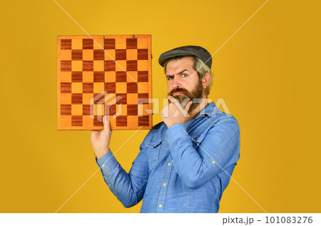 Enjoy tournament. Strategy concept. Chess competition. Board game. Thoughtful bearded man play chess. Chess figure. Intellectual game. Grandmaster player. Chess lesson. Cognitive development 101083276