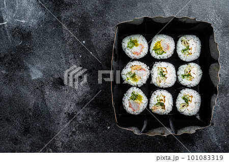 Kimbap or gimbap korean rice roll, Korean sushi. Black background. Top view. Copy space Kimbap or gimbap korean rice roll, Korean sushi. Black background. Top view. Copy space 101083319