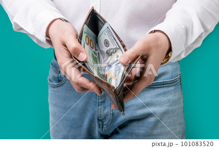 money salary in wallet. closeup of money salary at studio. man shows money salary. money salary in wallet. closeup of money salary at studio. man shows money salary. 101083520