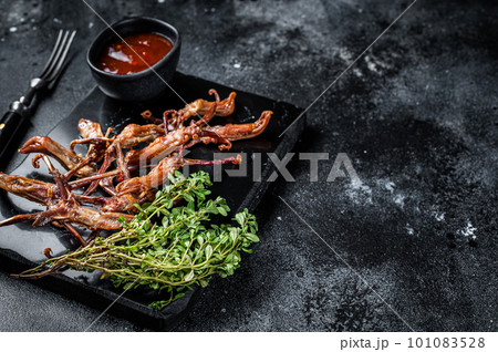 Chinese food dip fried duck tongue Black background. Top view. Copy space Chinese food dip fried duck tongue Black background. Top view. Copy space 101083528