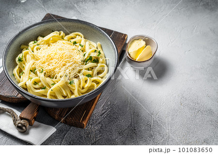 Spaetzle German egg noodles with cheese served with parsley. White background. Top view. Copy space 101083650