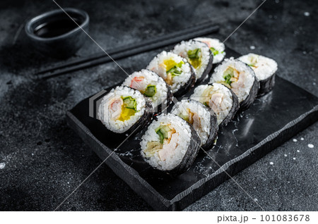 Korean rice roll Kimbap or gimbap, Korean sushi. Black background. Top view Korean rice roll Kimbap or gimbap, Korean sushi. Black background. Top view 101083678