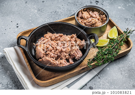 Canned tuna fillet meat ready for cooking. Gray background. Top view 101083821