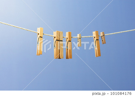 Wooden clothespin on the rope for drying clothes 101084176