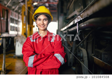engineering women in safety uniform operating machine at factory industrial and standing with smiling in workplace engineering women in safety uniform operating machine at factory industrial and standing with smiling in workplace 101084508
