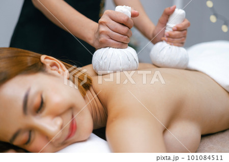 Beautiful woman doing Thai massage in spa Beautiful woman doing Thai massage in spa 101084511