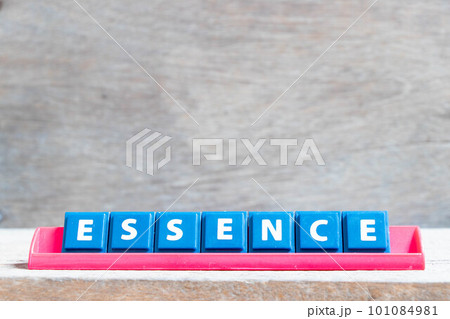 Tile alphabet letter with word essence in red color rack on wood background 101084981