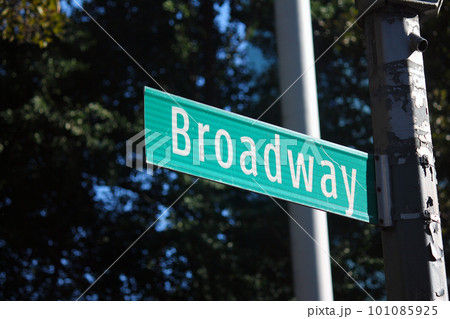 Broadway Street green traffic sign in New York between the skyscrapers 101085925