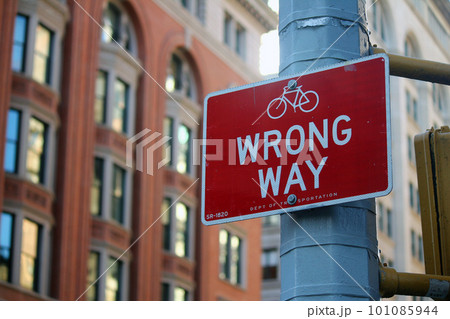 Red Wrong Way for bicycle direction traffic sign in Manhattan in New York City 101085944