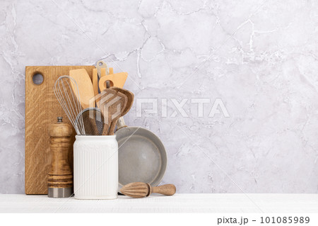 Kitchen utensils on wooden table Kitchen utensils on wooden table 101085989