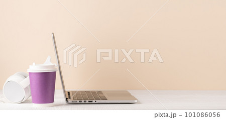 Laptop, headphones and coffee cup 101086056