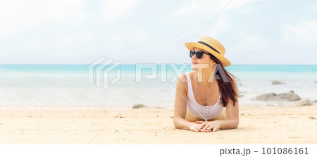 Woman lying on the sea beach 101086161