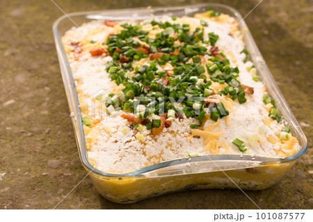 Banosh Hutsul cuisine. Corn porridge with cream, sheep cheese, cracklings Banosh Hutsul cuisine. Corn porridge with cream, sheep cheese, cracklings 101087577