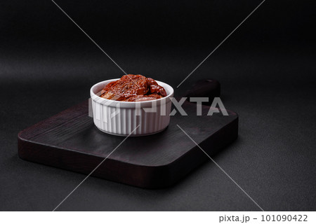 Delicious sun dried tomatoes in oil in a white ceramic bowl Delicious sun dried tomatoes in oil in a white ceramic bowl 101090422