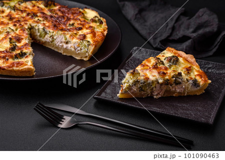 Delicious quiche with broccoli, cheese, chicken, spices and herbs Delicious quiche with broccoli, cheese, chicken, spices and herbs 101090463