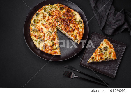 Delicious quiche with broccoli, cheese, chicken, spices and herbs 101090464