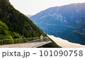Young man standing on the viewing platform with drone controller view of Hallstatt lake, mountains 101090758
