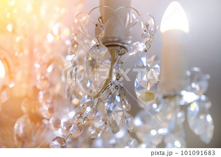 Close-up of a crystal chandelier with shallow depth of field, background Close-up of a crystal chandelier with shallow depth of field, background 101091683