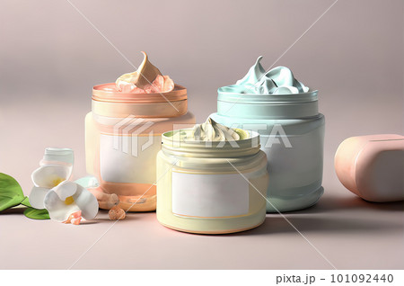 Three open jars of cosmetic cream stand on a white background 101092440