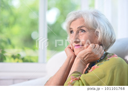 Beautiful elderly woman at the country house 101101768