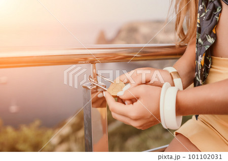 Hands, lock, heart, love, valentines day. Close-up of a woman's hands holding heart shaped padlock with a heart. The concept of Valentine's day, wedding, symbol of love and fidelity. 101102031