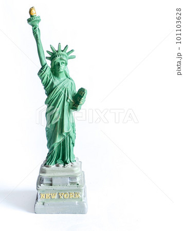 Small Liberty Statue souvenir on white background, a landmark of New York city 101103628